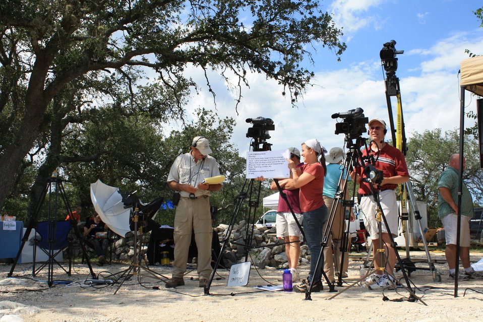 A camera crew filming on location in Highland Park